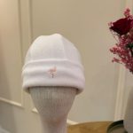 White hat with pink logo